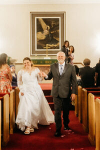 Couple walking down the aisle at Esther's Wedding Chapel