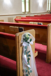 decorated pew at wedding chapel